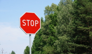 stop sign in front of trees